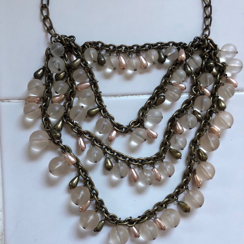 Multi Layer necklace in a soft blush color.